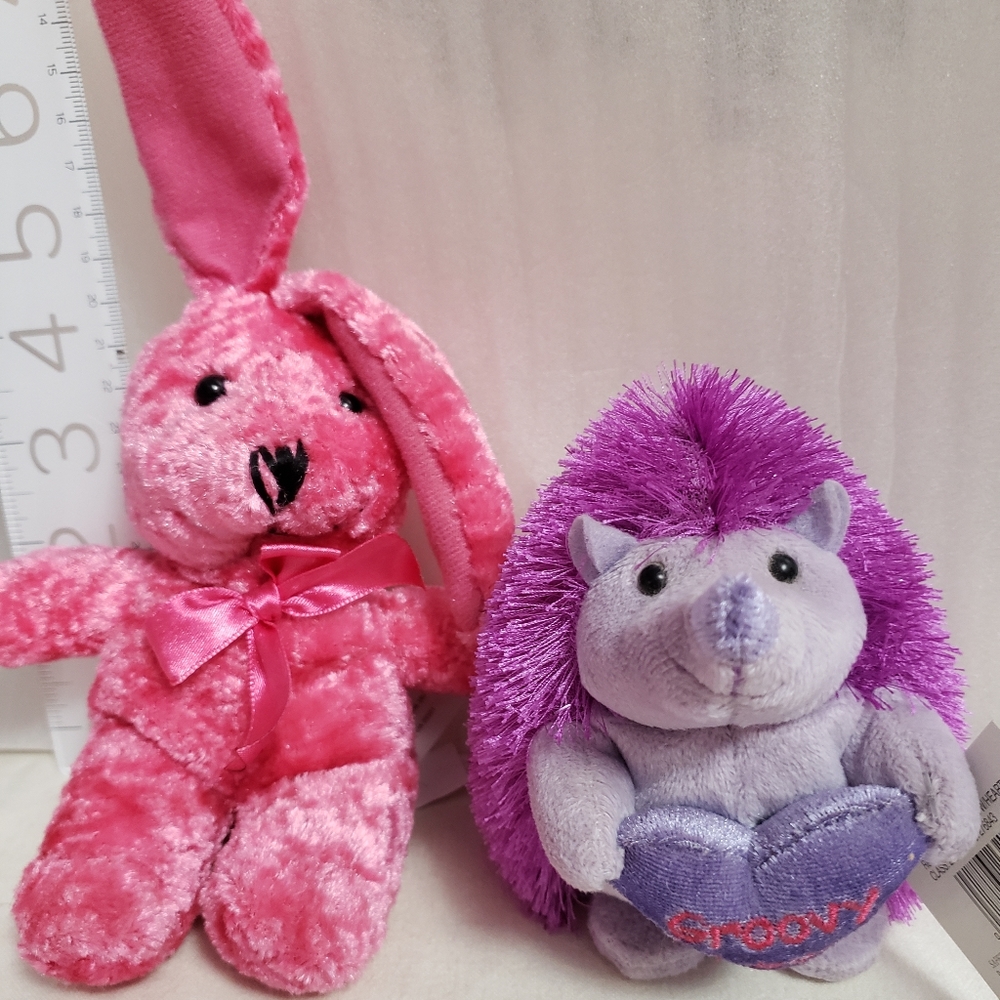 Cute little pair of stuffed animals. Hedgehog and pink bunny.